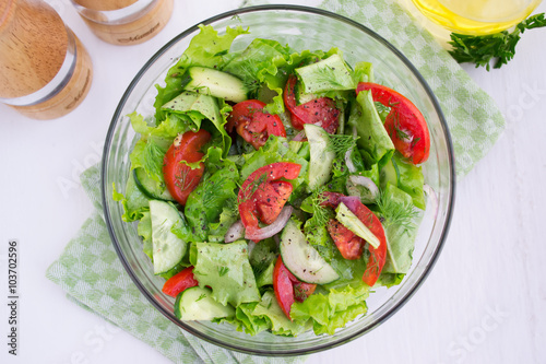 Vegetable salad of tomatoes, cucumbers and lettuce