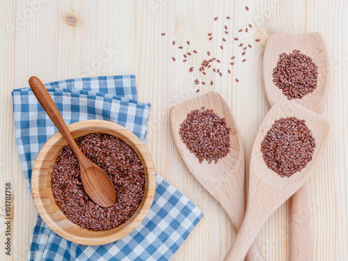 Alternative health care and dieting flax seeds in wooden spoon s photo