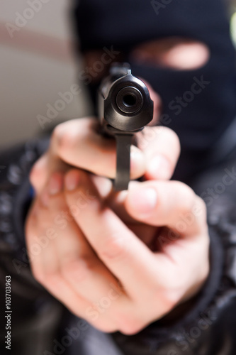 Aiming murderer with a gun