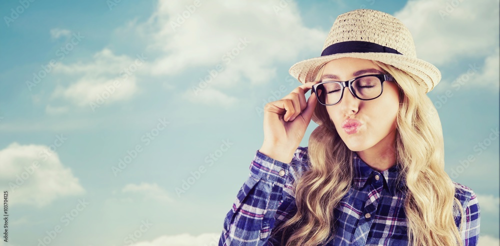 Composite image of gorgeous blonde hipster sending air kiss Composite image of gorgeous blonde hipster sending air kiss
