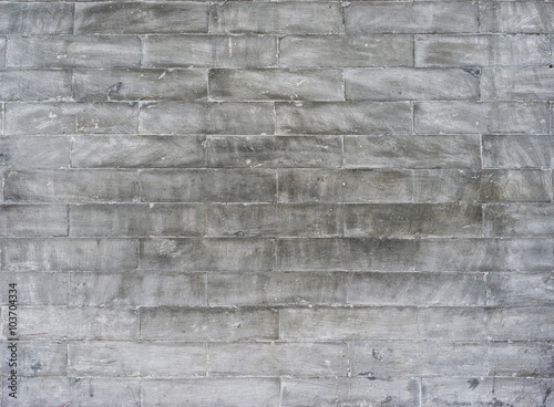 Wallpaper: old grey dirty bricks.