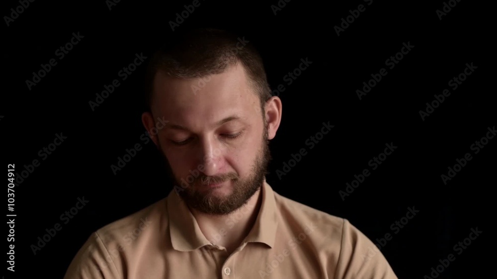 Man kneading batter on a wooden table. On black background. Man kneading batter on a wooden table. On black background.