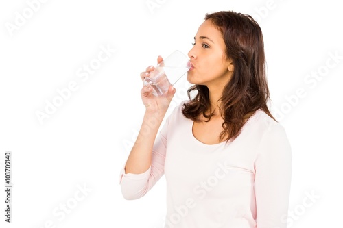 Gorgeous woman drinking a glass of water