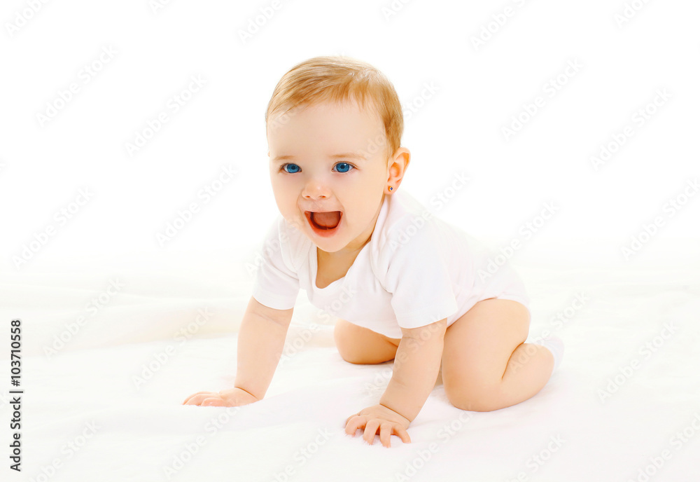 Happy smiling little baby crawls on a white background Happy smiling little baby crawls on a white background