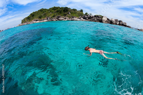 skindiving in the sea with goggles and a snorkel