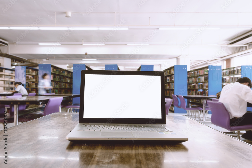 laptop with blank screen on the table in library