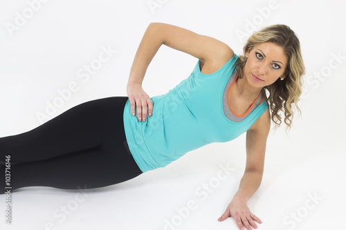 woman doing push-ups on white background