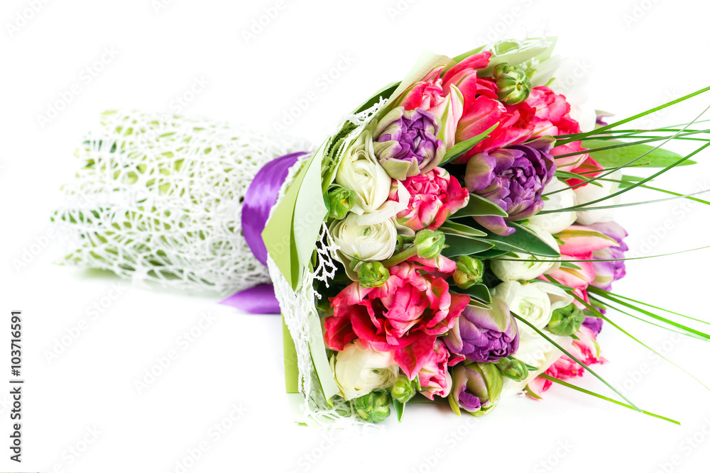 bright exotic bouquet of different color tulips and ranunkulyus