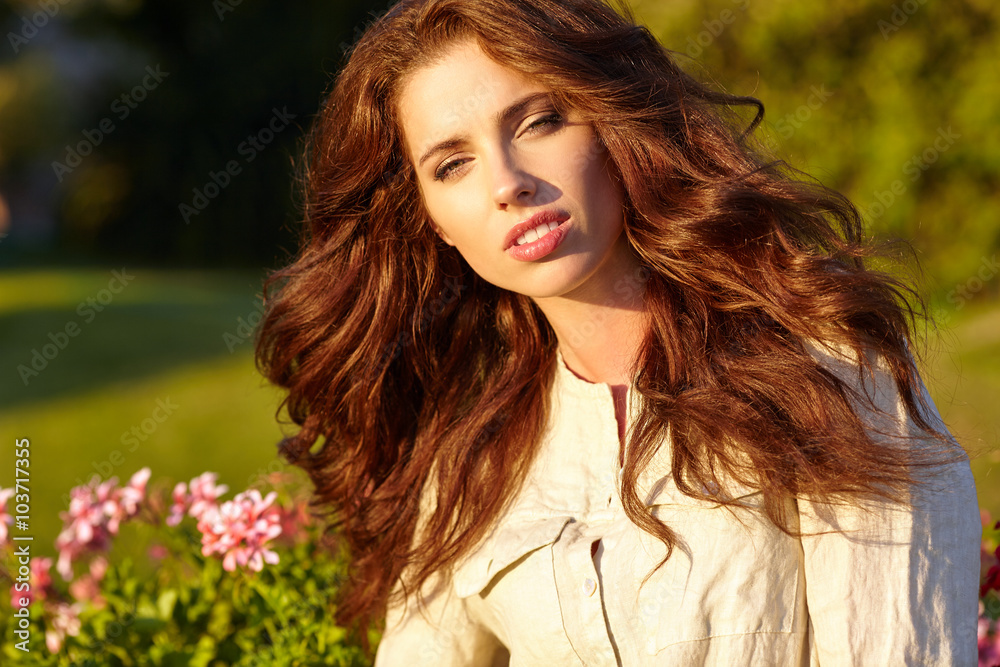 Portrait of the young beautiful smiling woman outdoors Portrait of the young beautiful smiling woman outdoors