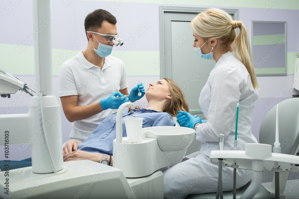Dentist examining a patient's teeth in the dentist.