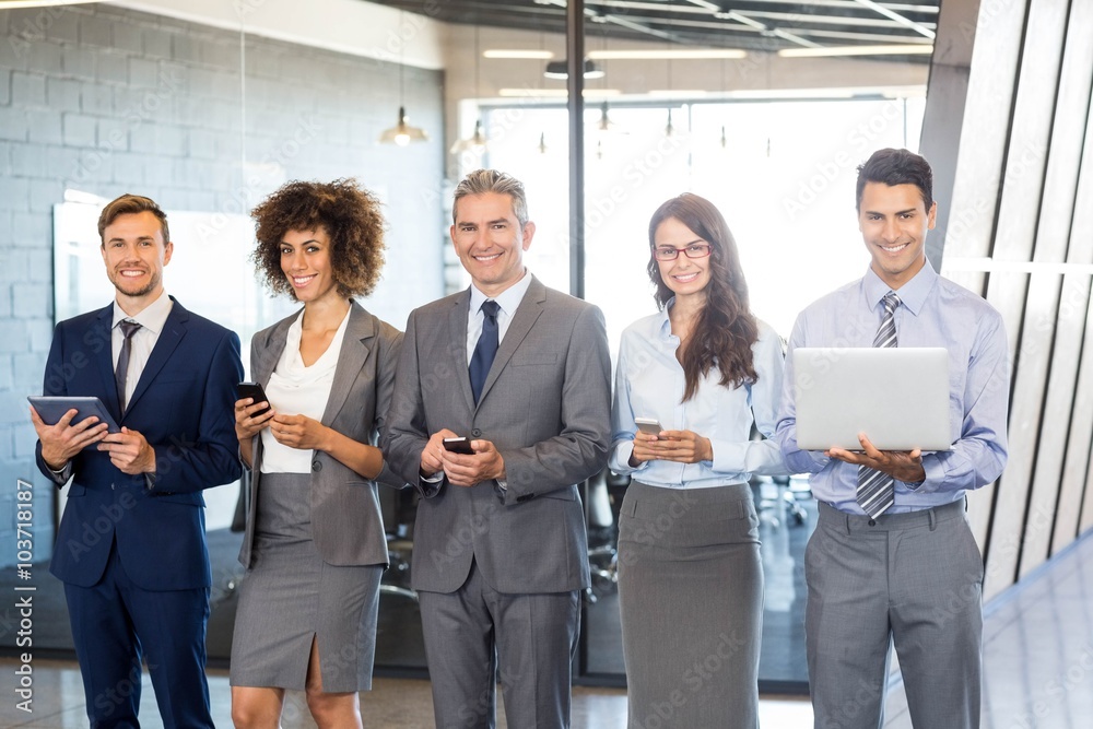 Businesspeople using mobile phone, lap top and digital tablet Businesspeople using mobile phone, lap top and digital tablet