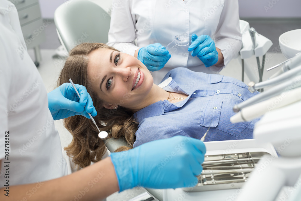 Dentist examining in the dentist. Dentist examining in the dentist.