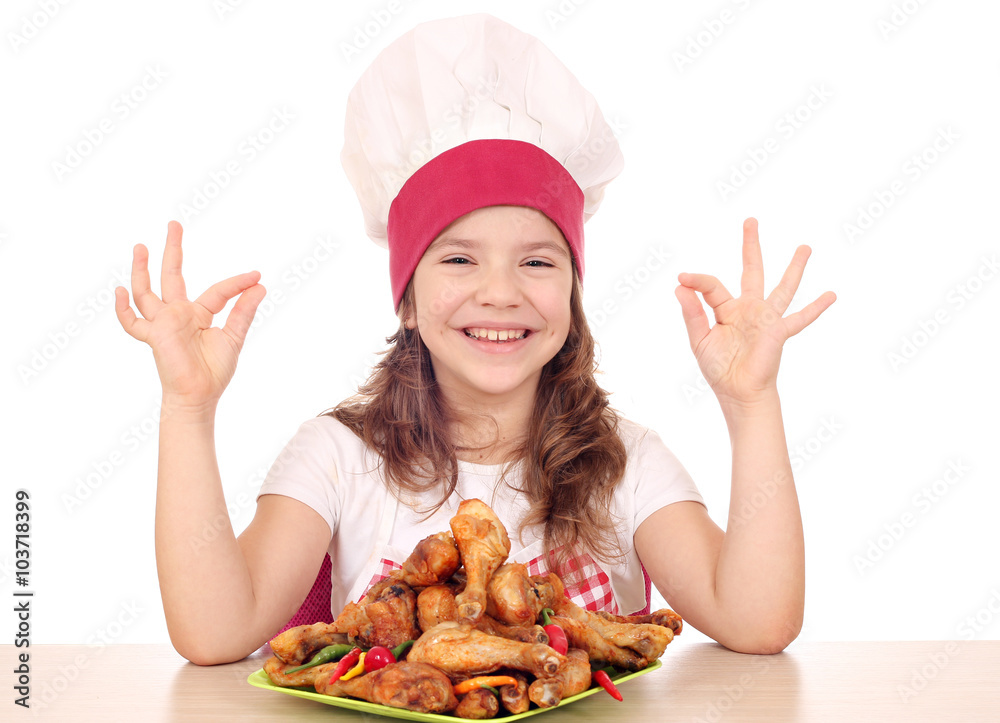 happy little girl cook with chicken drumstick and ok hand sign happy little girl cook with chicken drumstick and ok hand sign