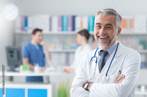 Confident doctor posing in the office photo
