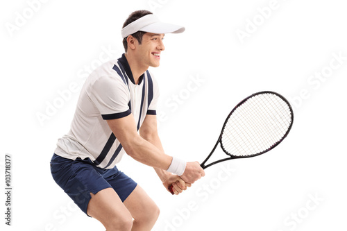 Cheerful young man playing tennis © Ljupco Smokovski
