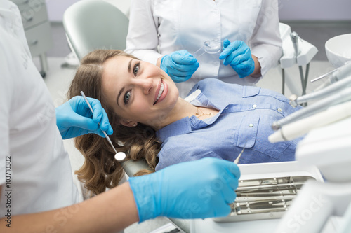 Dentist examining in the dentist.