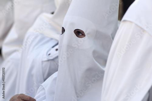 Nazarenos de la Hermandad de la Borriquita, semana santa de Sevilla photo