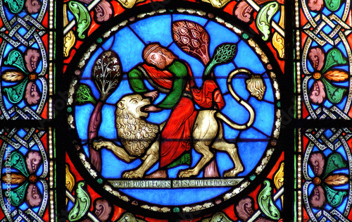 Stained glass window Samson slaying the lion