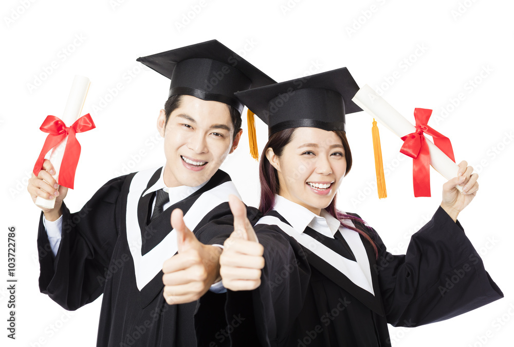 Graduation man and woman education students with thumb up Graduation man and woman education students with thumb up