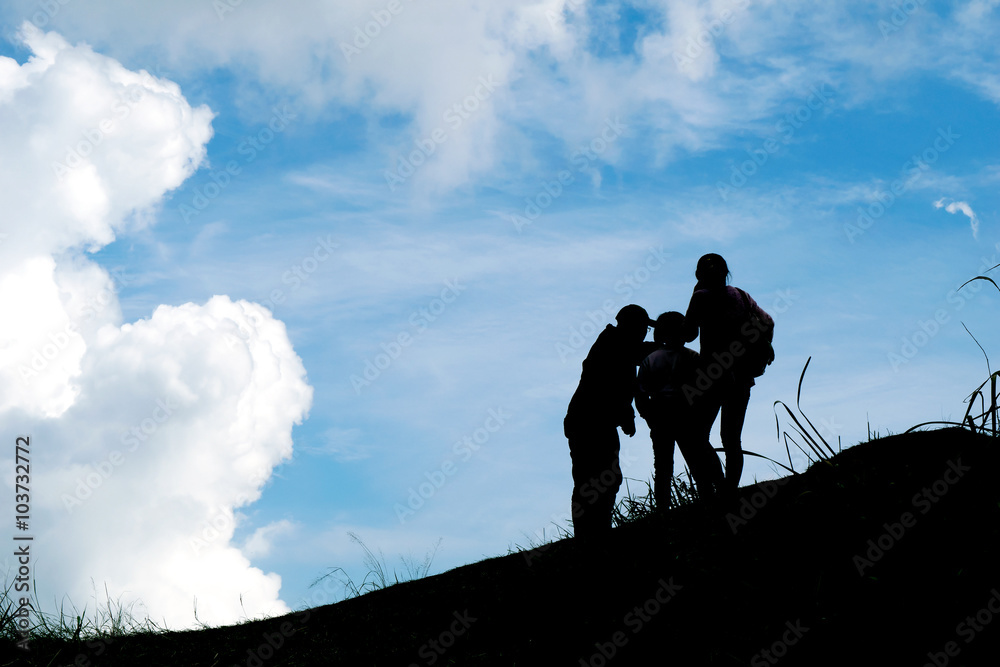 Silhouette travel family on mountain and Cloud blue sky