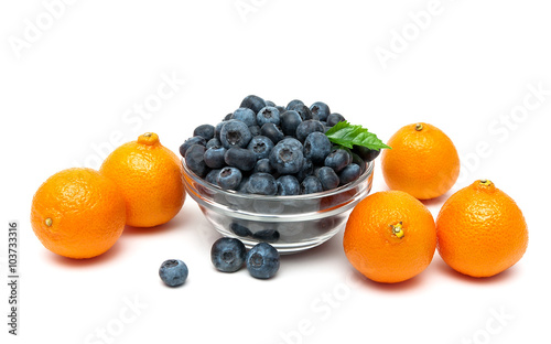 blueberries and tangerines on a white background