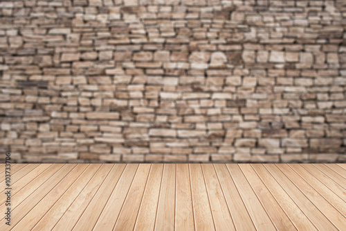 Empty top wooden table and natural stone wall background. For pr