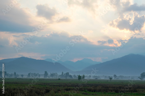 View field and Mountain in the morning - location at chiangkham phayao , thailand photo