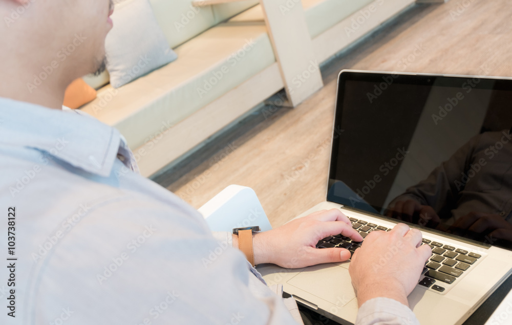 Man use laptop on the chair