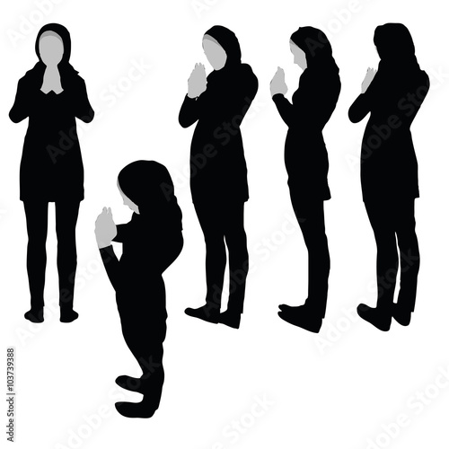 Muslim woman silhouette in pray pose