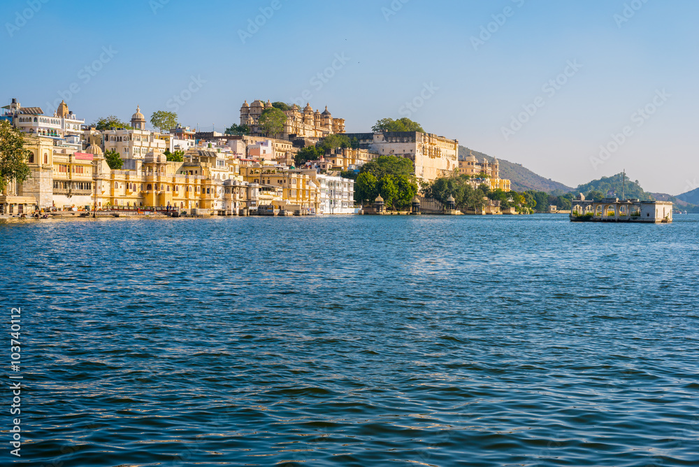 Lake Pichola with historical buildings of Udaipur old city in the background