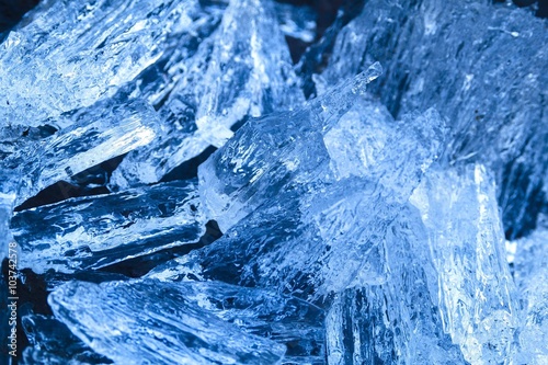 Beautiful ice from the river looks like a precious crystal or mineral.