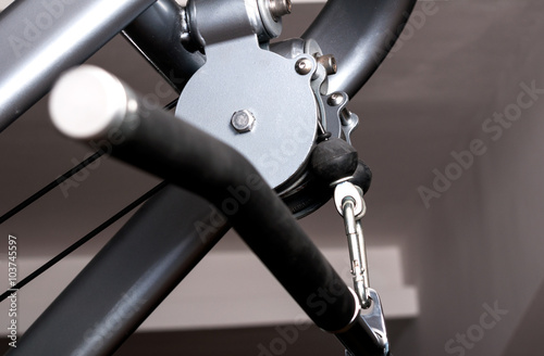 Close up pulley of gym equipment with handle