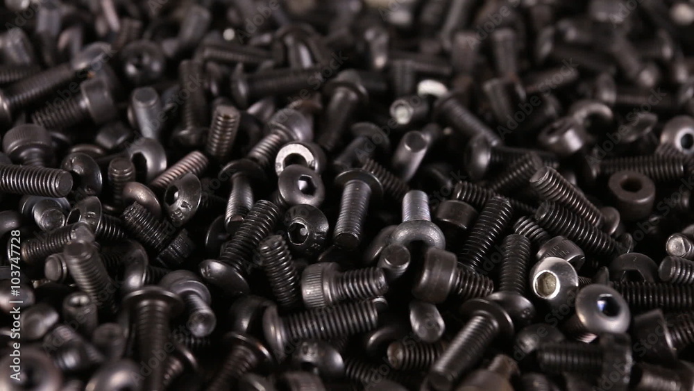 A pile of computer metallic screws. Macro shot. A pile of computer metallic screws. Macro shot.