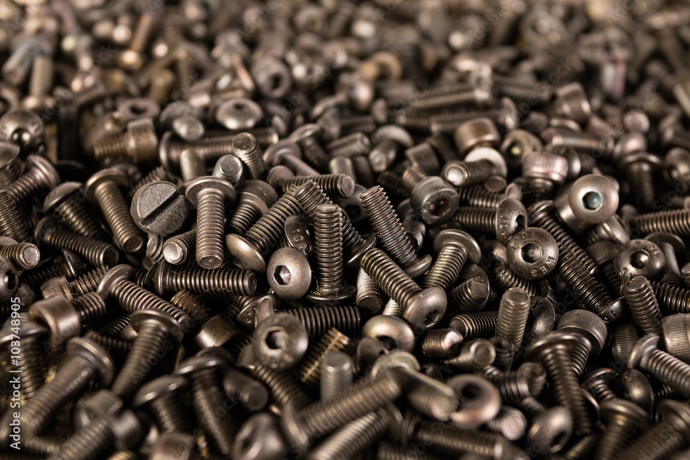 A pile of computer metallic screws. Macro shot. A pile of computer metallic screws. Macro shot.