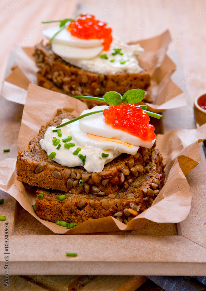 Red caviar with wholemeal bread. Red caviar with wholemeal bread.