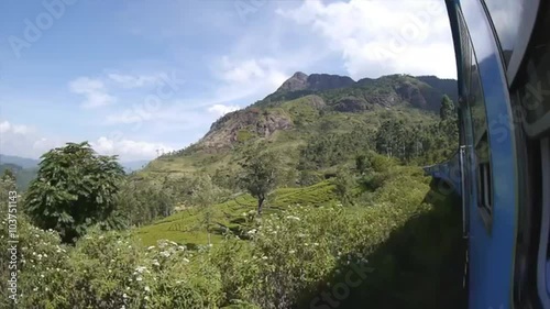 Riding the train through the beautiful landscape and mountains of Sri Lanka photo