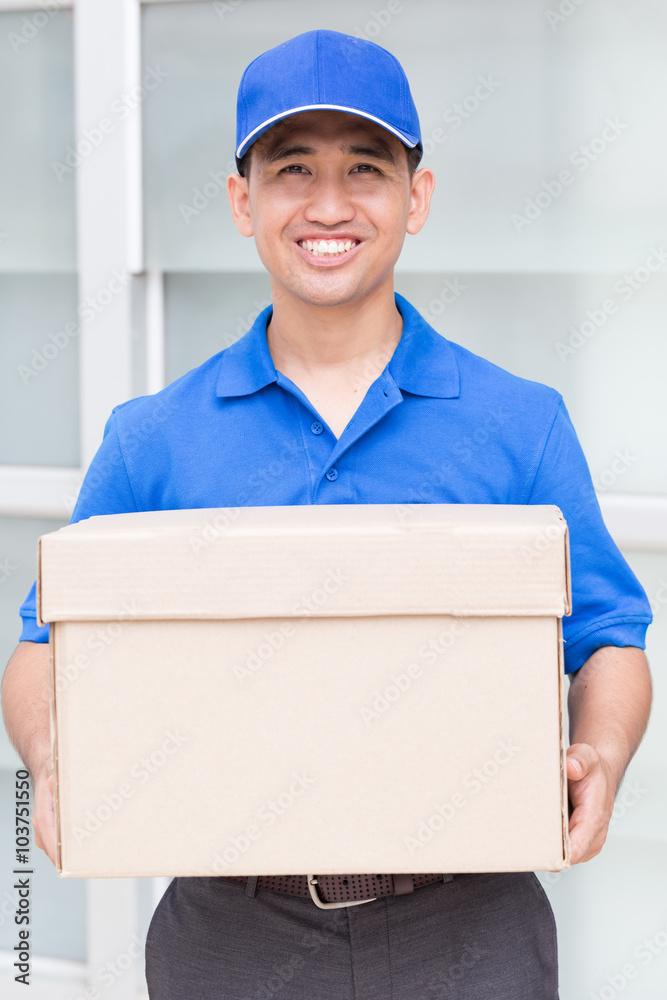 Delivery man holding a parcel box