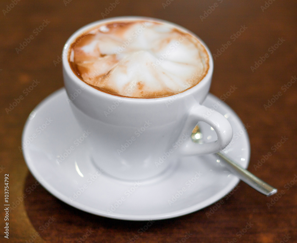 Cappuccino in a white cup on the table Cappuccino in a white cup on the table