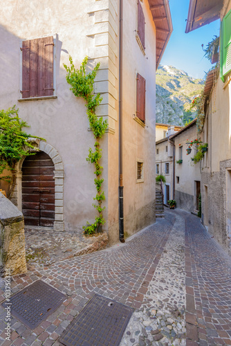 Fototapeta Naklejka Na Ścianę i Meble -  Picturesque small town street view in Limone, Lake Garda Italy.