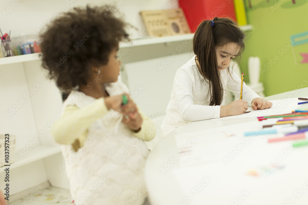 Multiracial children drawing in the playroom Multiracial children drawing in the playroom