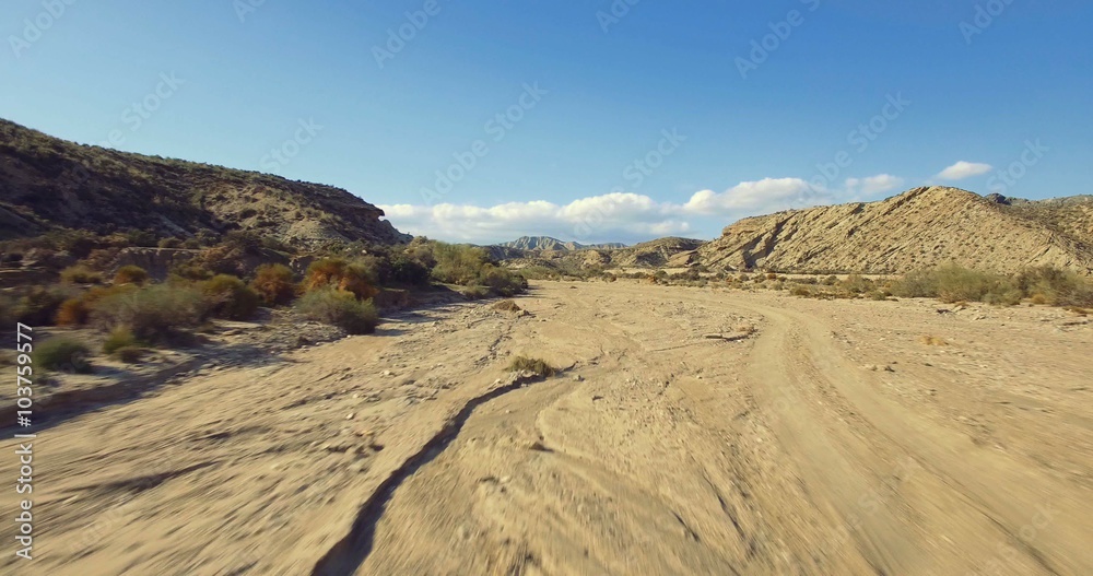 4K Aerial, Flight over a dry riverbed in a desert in Andalusia, Spain - Shot is additionally stabilized, graded and mostly accelerated. Watch also for the native versions 4K Aerial, Flight over a dry riverbed in a desert in Andalusia, Spain - Shot is additionally stabilized, graded and mostly accelerated. Watch also for the native versions