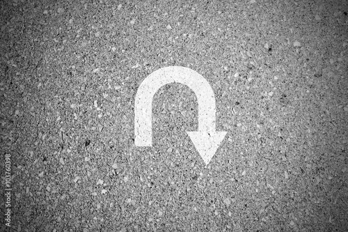 U-turn sign on asphalt concrete street