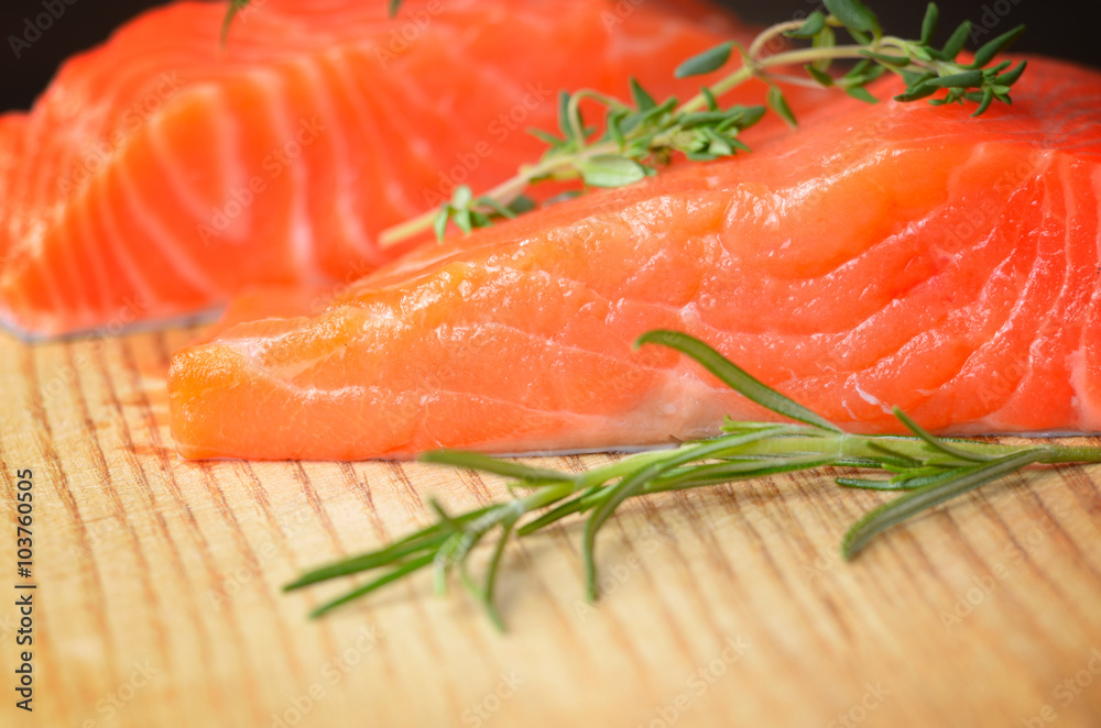 Raw salmon on cutting board