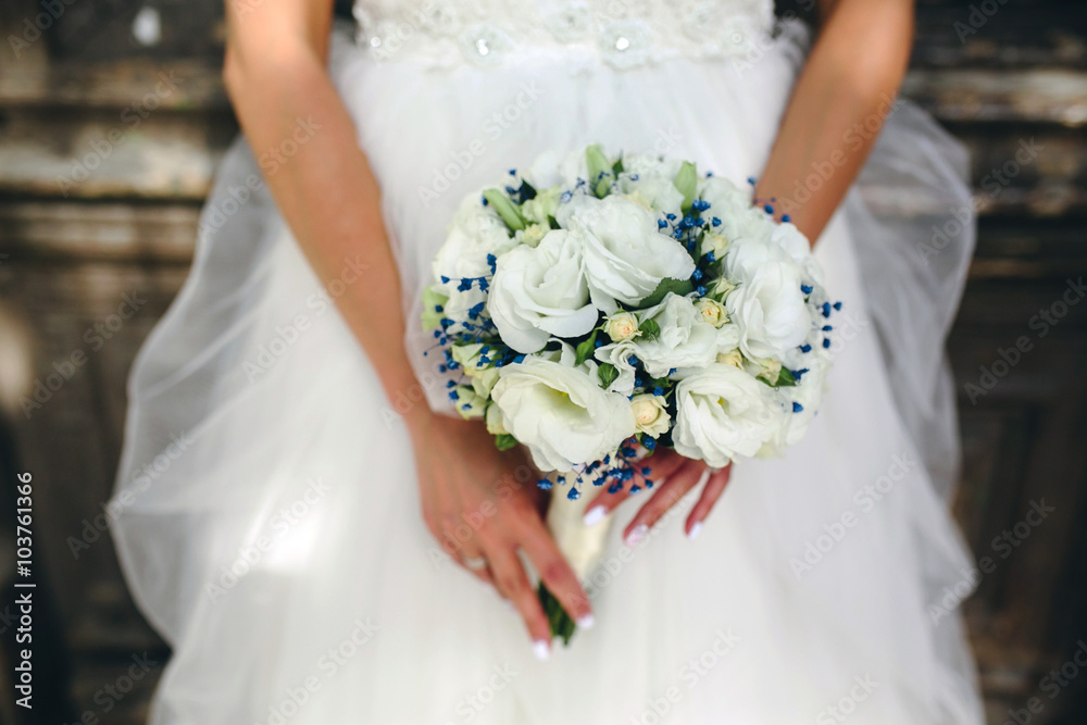 bride holding beautiful wedding bouquet
