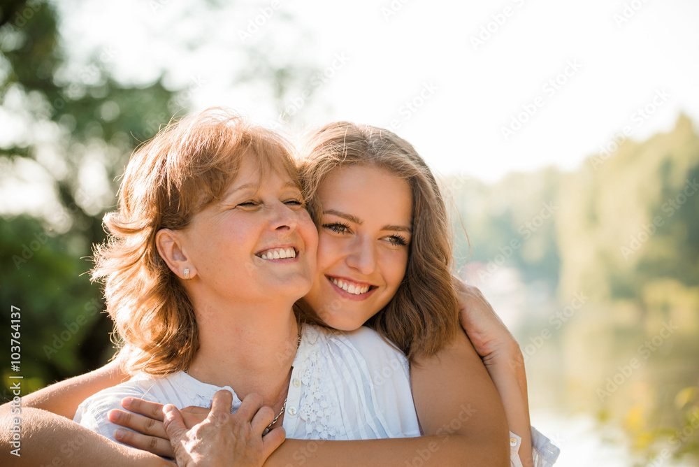 Happy together - mother and teenage daughter outdoor Happy together - mother and teenage daughter outdoor