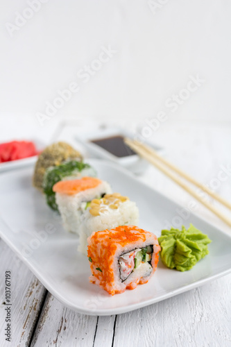 Sushi set on white wooden background