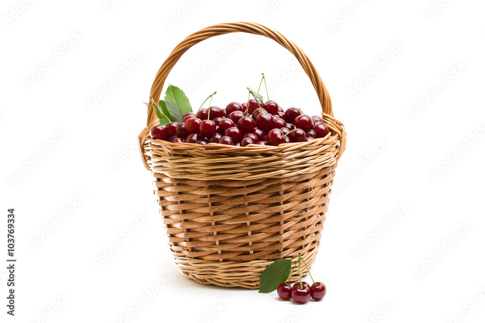 Basket full of fresh red cherry on a white background Basket full of fresh red cherry on a white background