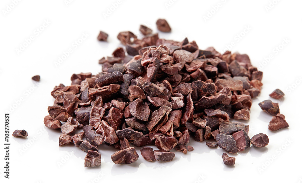 Heap of cacao nibs on white background Heap of cacao nibs on white background