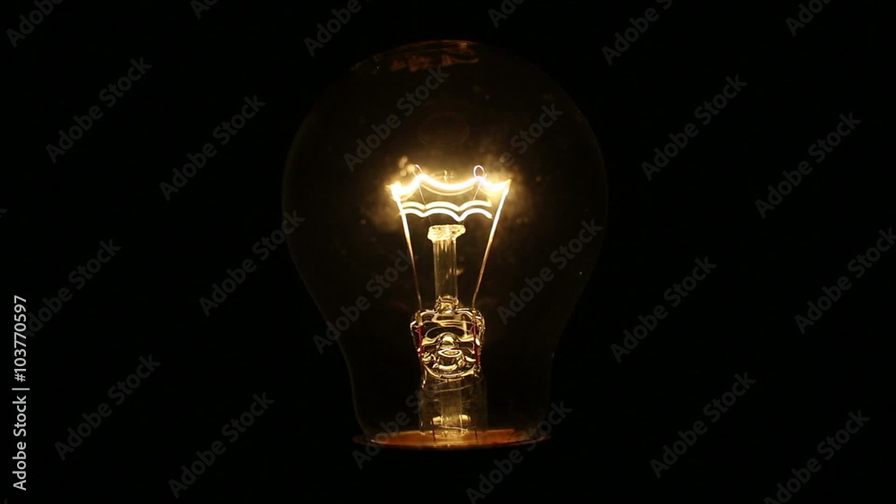 A light bulb illuminates a dark room, much like an idea in our mind.