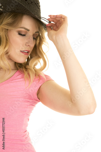 cowgirl in pink shirt black hat eyes closed close